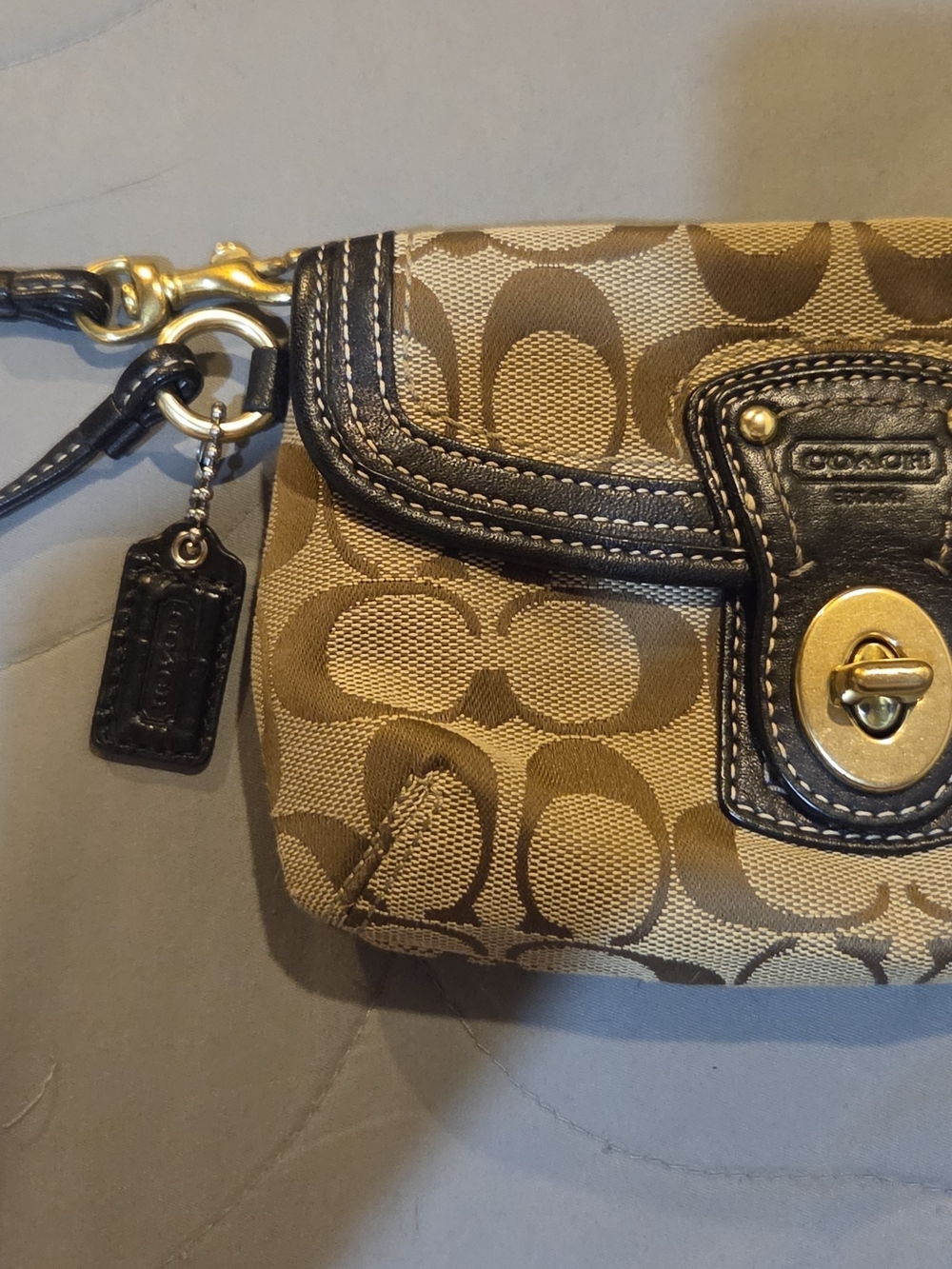 COACH Signature Canvas Turnlock Wristlet in Brown